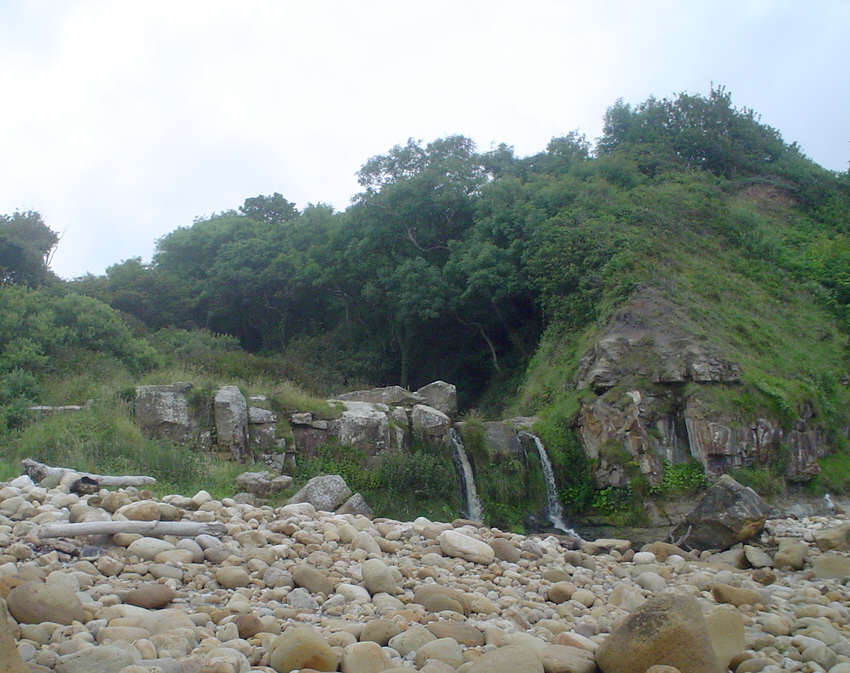 A view of the small waterfalls where the Hayburn Beck reaches the sea at Hayburn Wyke.