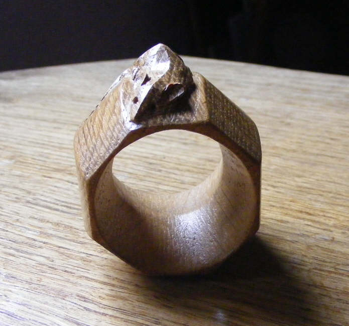 A head-on view of a Robert Thompson napkin ring and the famous mouse 